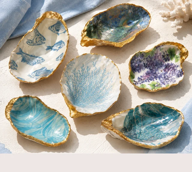 Gold-edged oyster shell trinket dishes