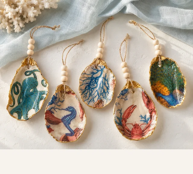 Hanging oyster shell ornaments on twine with wood beads